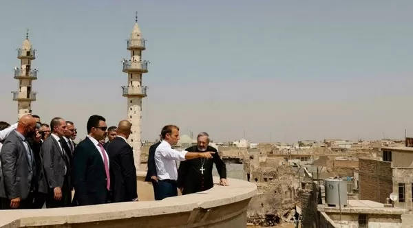 Macron visits the former IS group's stronghold in Iraq city of Mosul