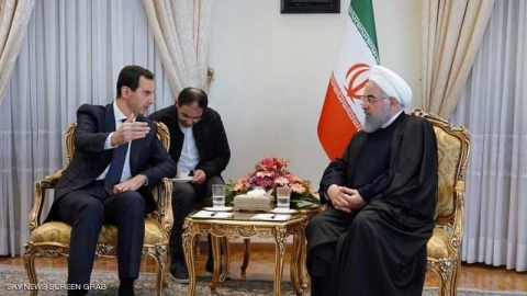 جدل بشأن غياب العلم السوري خلال زيارة الأسد لطهران