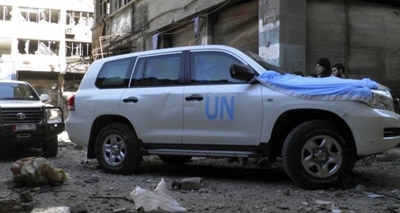Syria conflict: Homs aid convoy comes under fire