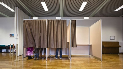 Switzerland narrowly votes to curb immigration 
