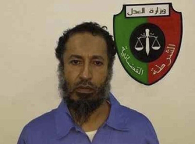Trial begins for Gaddafi sons and officials 