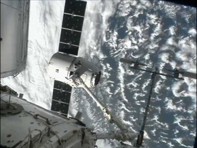 SpaceX supply capsule berths at ISS