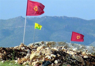 Protesters hang PKK and Öcalan flags on gendarmerie post construction site near Silvan dam 