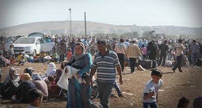 Turkish Forces Clash with Kurds; 70,000 Refugees Wash across Border 