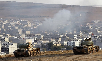 Battle for Syria's Kobani intensifies; ISIS takes Iraq base