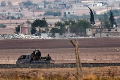 Syria says giving military support to Kurds in Kobane