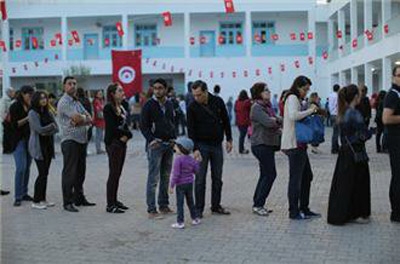 High turnout in Tunisia vote defies forecasts 