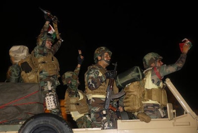 Kurdish peshmerga arrive with weapons in Syria's Kobani 