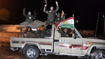 AP Interview: Iraqi Kurds in Kobani 'Temporarily'