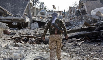 Islamic State group attacks Kobani, Syria, from Turkey, Kurds say