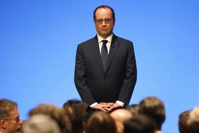 Hollande reassures Muslims, Islamists hack French websites
