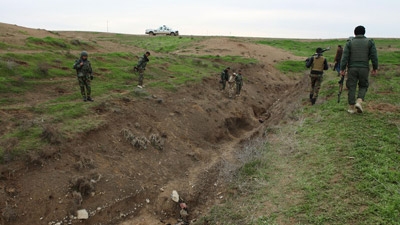 Syrian Kurds battling ISIS capture strategic Kobane hill top