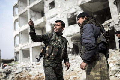 Kurds Scour Kobani for Bombs and Bodies
