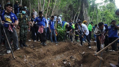 Malaysia finds mass graves at suspected human trafficking camps