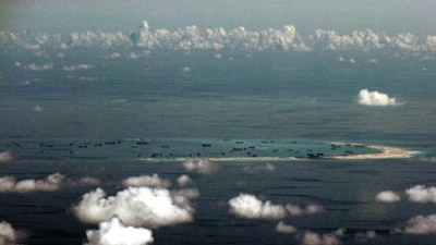 US hits China over sea reclamation, vows more patrols