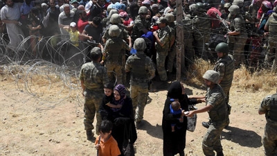 More than 3,000 cross to Turkey as Kurds battle ISIS in Syria 