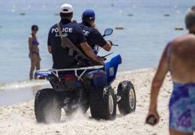 Armed Tunisian police swarm streets of tourist towns 