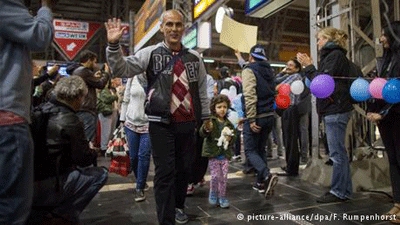 Germans welcome thousands of newly arrived refugees