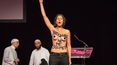 Femen activists in topless protest at French Islam conference on women
