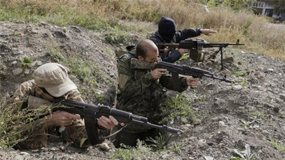 Ukrainian forces and rebels clash despite truce