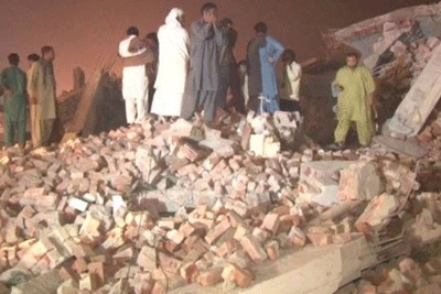 Pakistan factory collapses, killing at least 18, scores trapped