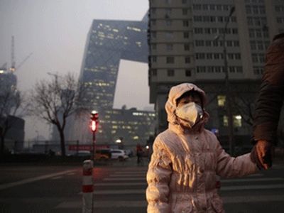 Beijing schools close for days as city issues first smog red alert