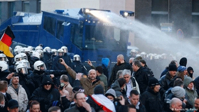 German police fire water cannons to disperse protesters amid clashes in Cologne