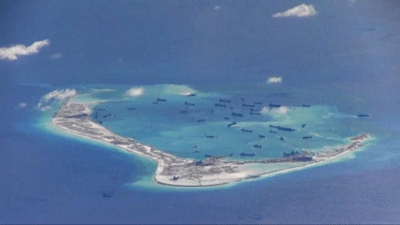 China signals no South China Sea backdown as foreign minister goes to U.S.