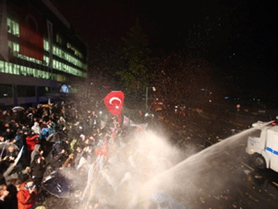 Turkey's Zaman newspaper reopens under government control, heavy police guard