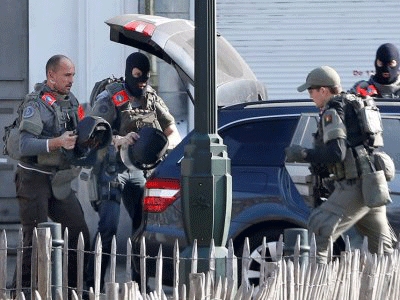 Shots fired in Brussels during police raid linked to Paris attacks