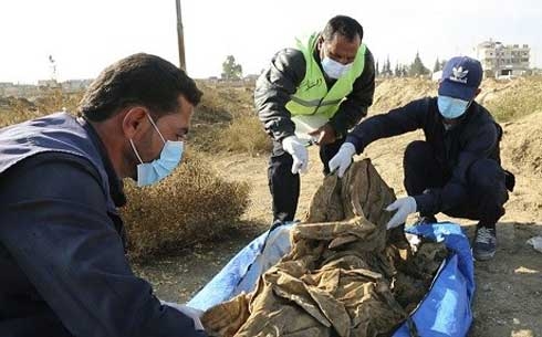 Hundreds of bodies exhumed from mass grave in Syria’s Raqqa