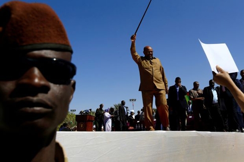 Day into emergency rule, Sudan's Bashir names VP and prime minister