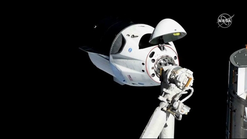 Milestone: Capsule with dummy aboard docks at space station