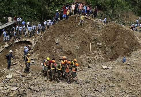 Hope fades in Philippines for dozens buried in landslides