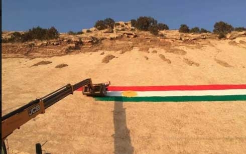 Man Paints Big Kurdish Flag on Mountain in Koya