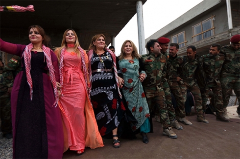 Peshmerga and locals celebrate the New Year on front line facing Iraqi forces